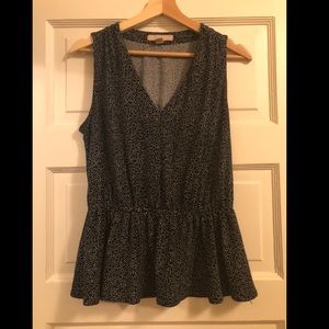 Navy blue / white polka dot sleeveless peplum top